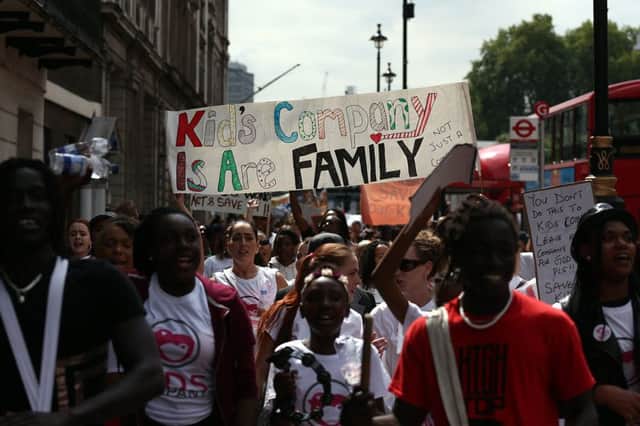 Staff and supporters of Kids Company charity march towards Downing Street as they protest against its closure. Pic: Getty