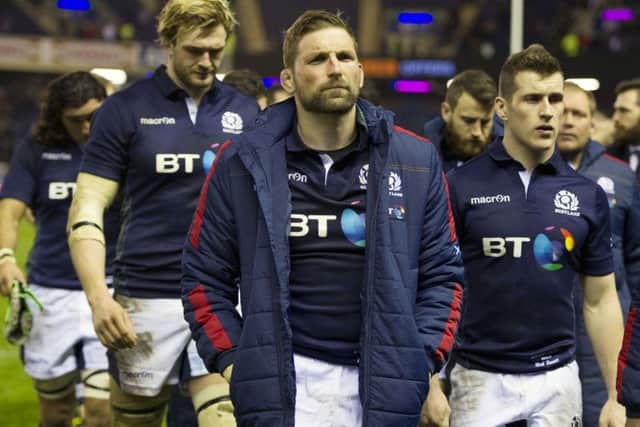Richie Gray, John Barclay and Mark Bennett trudge off the pitch. Picture: Ian Rutherford