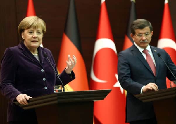 German Chancellor Angela Merkel and Turkish PM Ahmet Davutoglu in Ankara. Picture: AFP/Getty Images