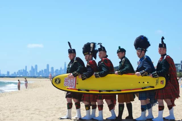 Royal Edinburgh Military Tattoo pipers taking a break on Brighton beach in Melbourne, Australia. Picture: PA