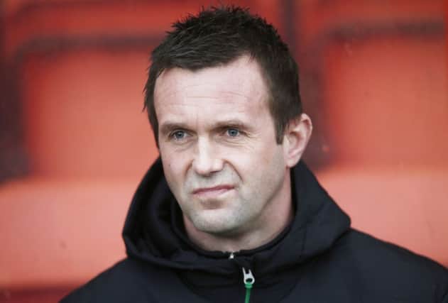 Celtic boss Ronny Deila has endured a difficult few weeks after his side slipped to two high-profile defeats. Picture: PA