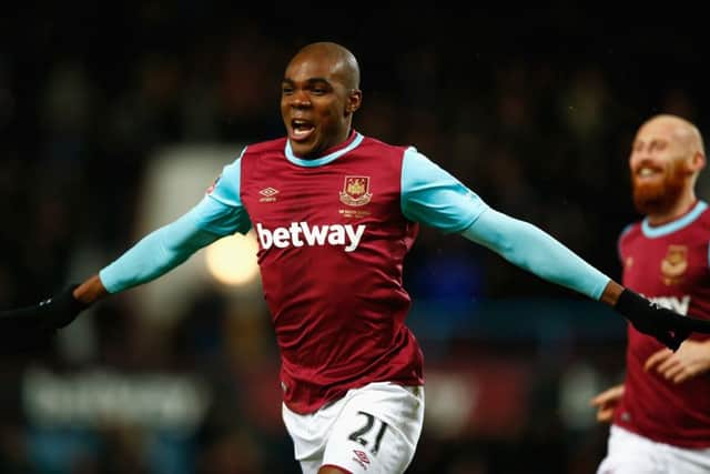 Angelo Ogbonna celebrates after scoring West Ham's extra-time winner against Liverpool in the FA Cup fourth round replay at Upton Park. Picture: Clive Rose/Getty Images