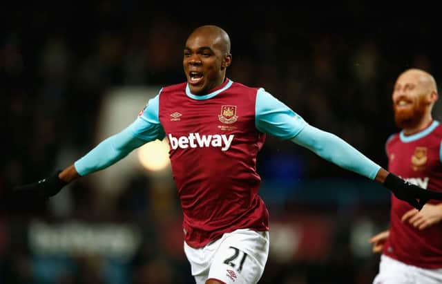 Angelo Ogbonna celebrates after scoring West Ham's extra-time winner against Liverpool in the FA Cup fourth round replay at Upton Park. Picture: Clive Rose/Getty Images