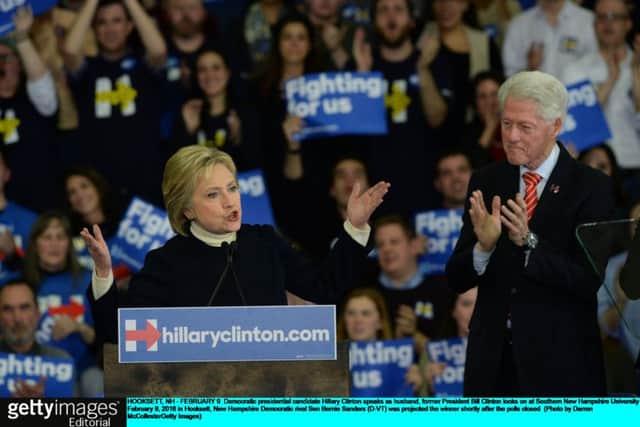 Democratic presidential candidate Hillary Clinton speaks as husband, former President Bill Clinton looks on . Picture: Getty