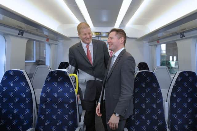 Mr Derek Mackay, Transport Minister and Phil Verster, managing director of the ScotRail Alliance have look around the interior of the new train.

 Neil Hanna Photography