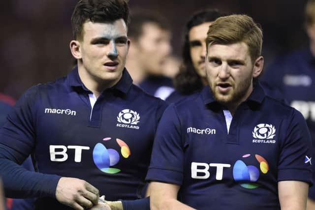 A dejected Matt Scott, left, and Finn Russell after the defeat by England. Picture Ian Rutherford