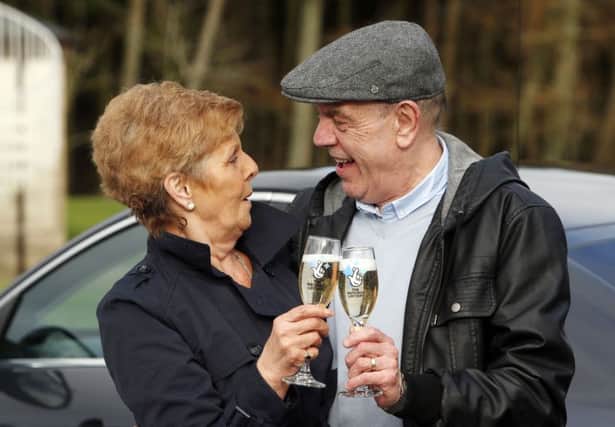 Euromillions raffle winner Arthur Howard and his wife Emma . Picture: PA