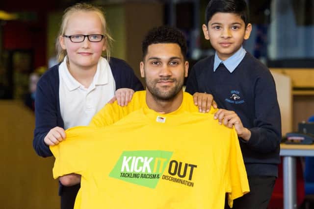 Rangers goalkeeper and Kick It Out ambassador Wes Foderingham alongside Aimee Dalgleish and Bipin Ghimire from Ibrox Primary School. Picture: SNS