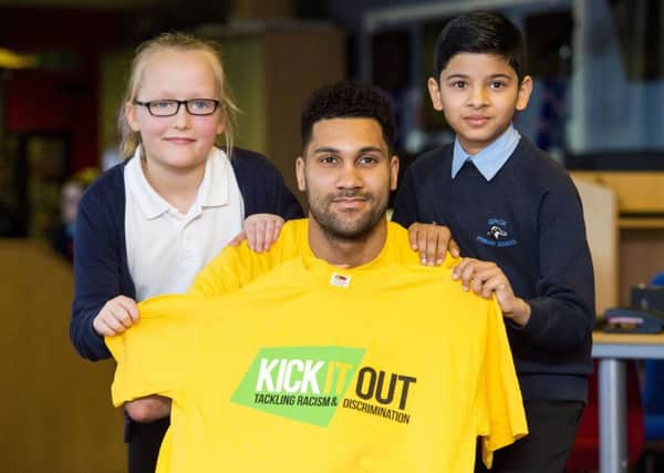 Rangers goalkeeper and Kick It Out ambassador Wes Foderingham alongside Aimee Dalgleish and Bipin Ghimire from Ibrox Primary School. Picture: SNS