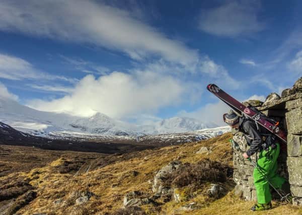 A skier looks over to the Fannaichs, a region of 10 Munros, including Sgurr Mor. Picture: Jamie Johnstone