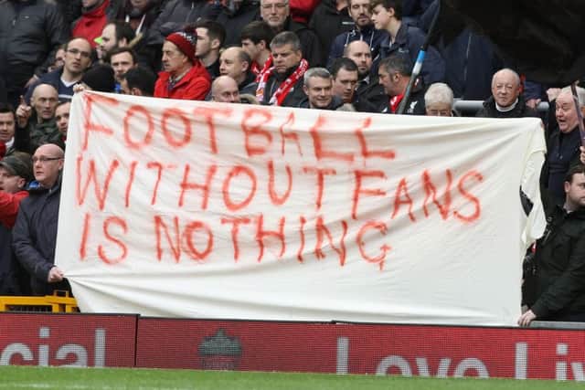 Liverpool fans hold up banners protesting against proposed ticket price rises at Anfield. Picture: AFP/Getty