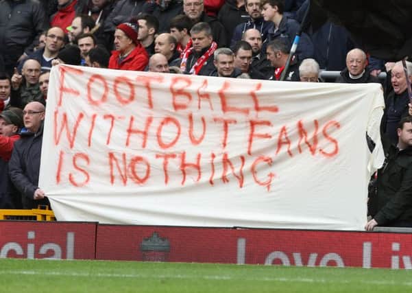 Liverpool fans hold up banners protesting against proposed ticket price rises at Anfield. Picture: AFP/Getty