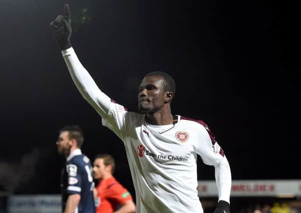 Hearts striker Abiola Dauda celebrates after scoring the first of his two goals against Ross County. Picture: SNS