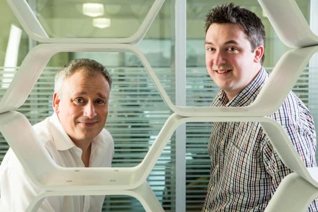 SwarmOnline founder Andrew Duncan, right, with client services director Tony McKenzie. Picture: Peter Devlin