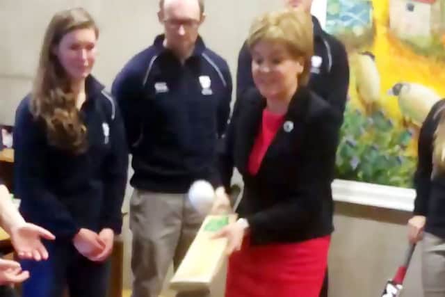 Nicola Sturgeon shows off her technique with a bat and ball at Holyrood. Picture: twitter/scotgovfm