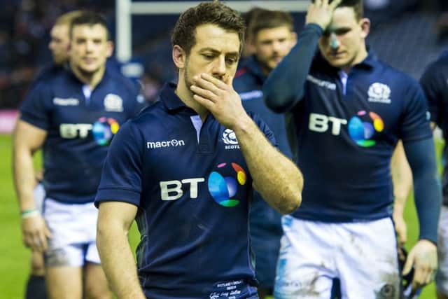 A disappointed Scotland squad leave the Murrayfield turf after a 9-15 defeat to England. Picture: SNS