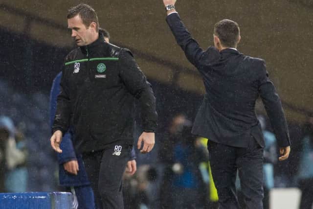 Ronny Deila is dejected as Jim McIntyre celebrates during Ross County's semi-final win. Picture: SNS