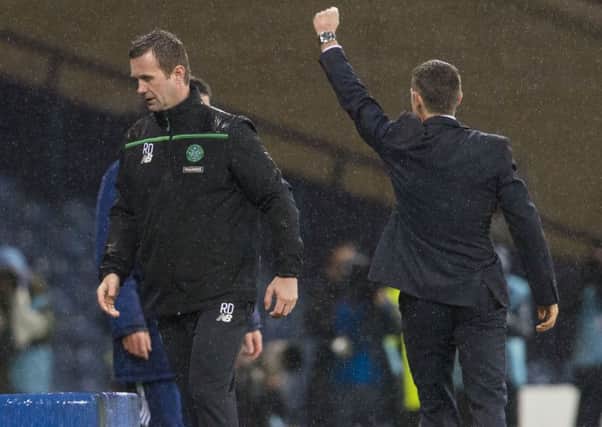Ronny Deila is dejected as Jim McIntyre celebrates during Ross County's semi-final win. Picture: SNS
