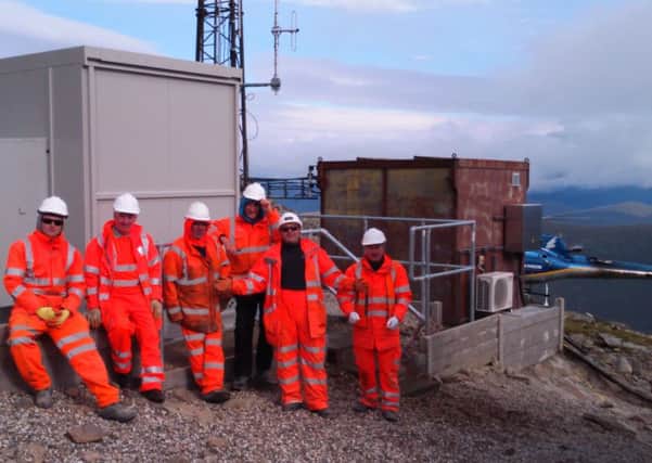 Installing Britains highest railway signalling equipment on the White Corries has involved workers moving a one-tonne base station using both helicopter and snow tractor