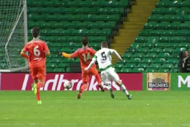 Jack Aitchison puts pressure on Valencia defender David Pascual.