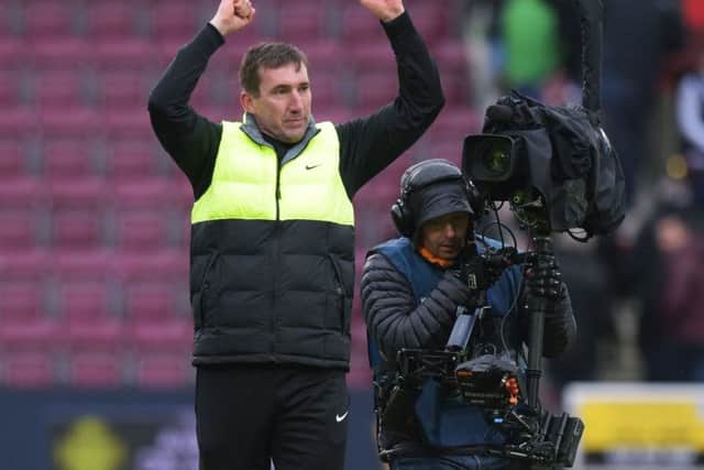 Hibs boss Alan Stubbs celebrates at Tynecastle after his team's battling Scottish Cup draw. Picture: SNS Group