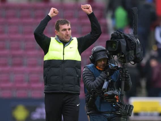 Hibs boss Alan Stubbs celebrates at Tynecastle after his team's battling Scottish Cup draw. Picture: SNS Group