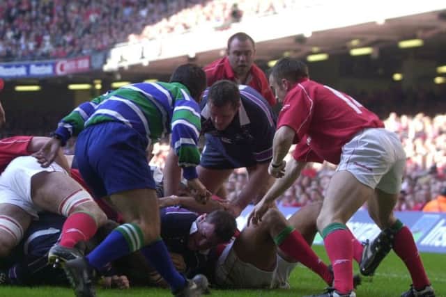 Hooker Gordon Bulloch crashes over for a try in Scotlands last win against Wales in Cardiff in 2002, but Simon Taylors memories of the game are vague. Picture: Neil Hanna