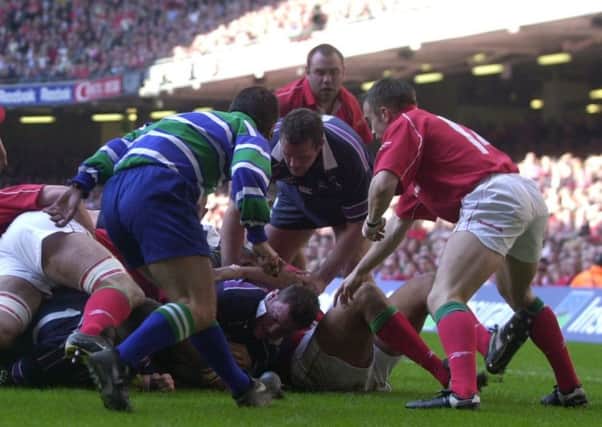 Hooker Gordon Bulloch crashes over for a try in Scotlands last win against Wales in Cardiff in 2002, but Simon Taylors memories of the game are vague. Picture: Neil Hanna