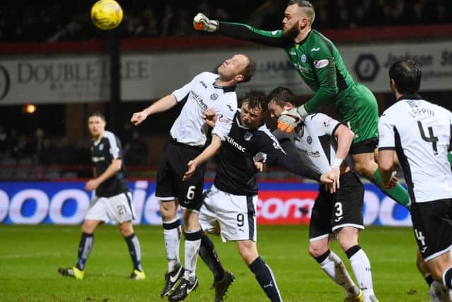 St Johnstone's Steven Anderson helps his goalkeeper Alan Mannus clear the danger from Dundee's Rory Loy. Picture: SNS Group