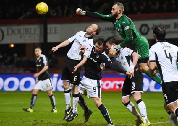 St Johnstone's Steven Anderson helps his goalkeeper Alan Mannus clear the danger from Dundee's Rory Loy. Picture: SNS Group