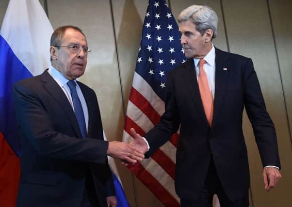 Russian Foreign Minister Sergei Lavrov (left) and US Secretary of State John Kerry shake hands as they meet for diplomatic talks. Picture: AFP/Getty Images