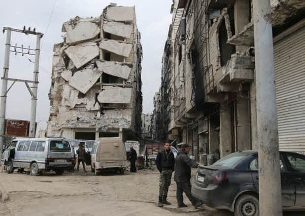 Syrian government troops are close to retaking the city of Aleppo, which has suffered substantial damage from Russian bombing  Picture: Alexander Kots/Komsomolskaya Pravda via AP