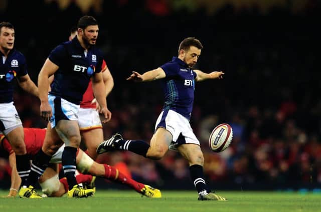 Up and away: Scotland captain Greig Laidlaw lifts the pressure as he clears the ball. Picture: Getty Images