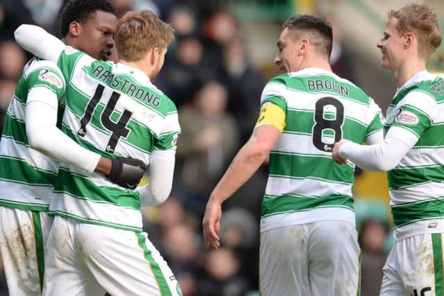 Celtic's Dedryck Boyata (left) celebrates having scored the second