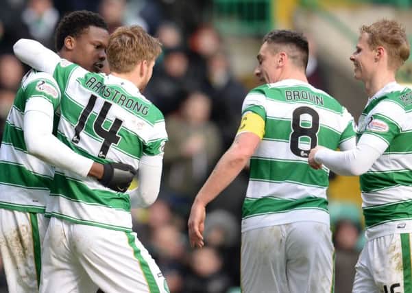 Celtic's Dedryck Boyata (left) celebrates having scored the second