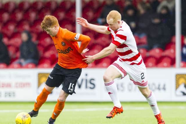 Dundee Utd's Simon Murray (left) battles with Hamilton's Ziggy Gordon