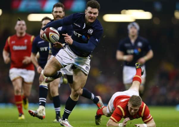 Duncan Taylor wrong foots Gareth Anscombe of Wales to score Scotland's second try but it was not enough.  Picture: Michael Steele/Getty Images