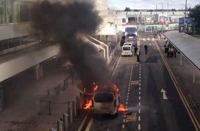 The vehicle on fire outside the terminal building. Picture: BBC/@BBCEleanorG