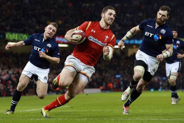 Welsh winger George North runs in his sides third and decisive try at the Principality Stadium on Saturday. Picture: AP