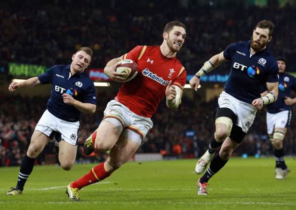 Welsh winger George North runs in his sides third and decisive try at the Principality Stadium on Saturday. Picture: AP