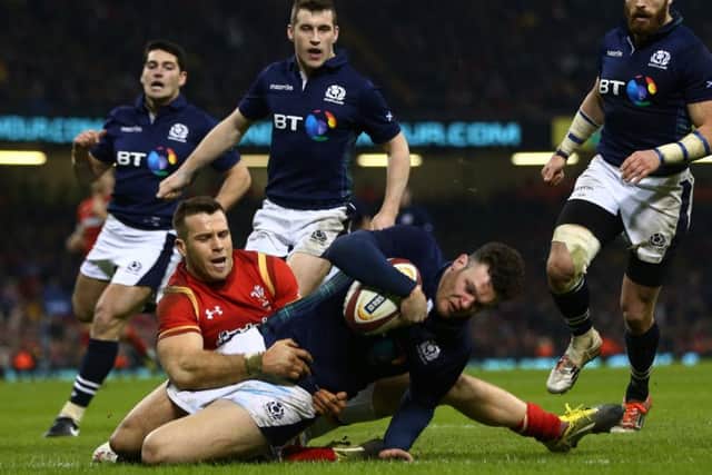 Scotlands Duncan Taylor holds off Gareth Davies to score a last-gasp try. Picture: Getty Images