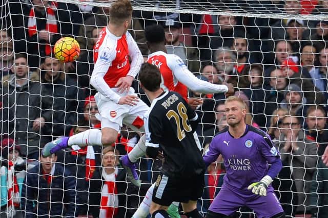 Danny Welbeck heads home Arsenals winner against Leicester City in the last minute yesterday. Picture: AFP/Getty Images