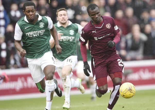 Hearts' Abiola Dauda (right) in action against Hibs' Marvin Bartley in the Scottish Cup 5th Round tie at Tynecastle. 
Picture: Greg Macvean