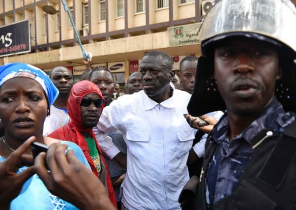 Kizza Besigye  is arrested while holding his last rallies in Kampala. Picture: AFP/Getty Images