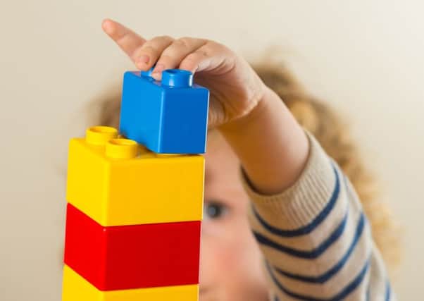 Off their blocks? Parents spend most in the early years, shelling out on about £64k a year. Picture: PA