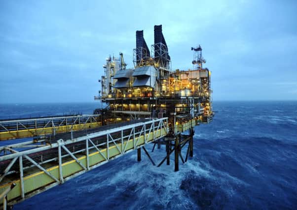The Deputy First Minister has called on the Chancellor to cut headline taxes on the crisis-hit North Sea oil industry. Picture: PA
