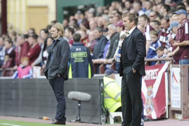 Hearts coach Robbie Neilson, left, and Hibs boss Alan Stubbs, right, get on well with each other despite the rivalry between the clubs. Picture: Greg Macvean