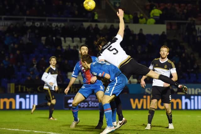 Aberdeen's Ash Taylor just prior to being booked for deliberate handball. Picture: SNS