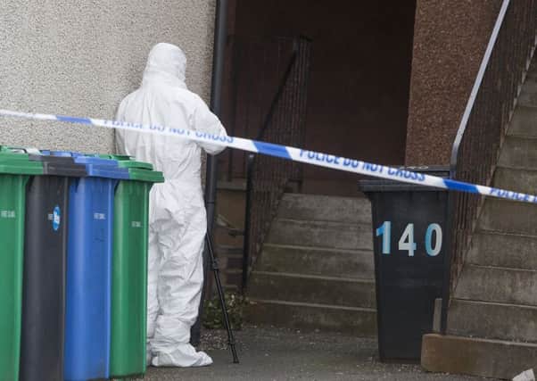 Forensic officer outside flats in Leven, Fife where a five-month-old baby is believed to have suffered serious life-threatening injuries. Picture: Hemedia
