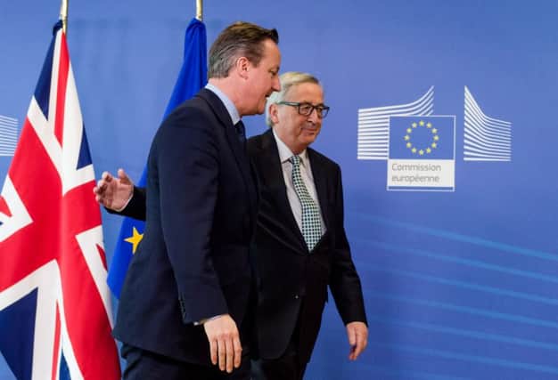 British Prime Minister David Cameron, left, is greeted by European Commission President Jean-Claude Juncker . Picture: AP